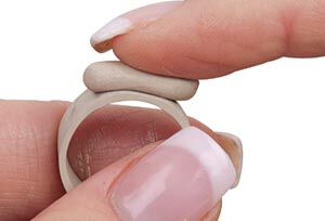 Clay being pressed onto clay ring
